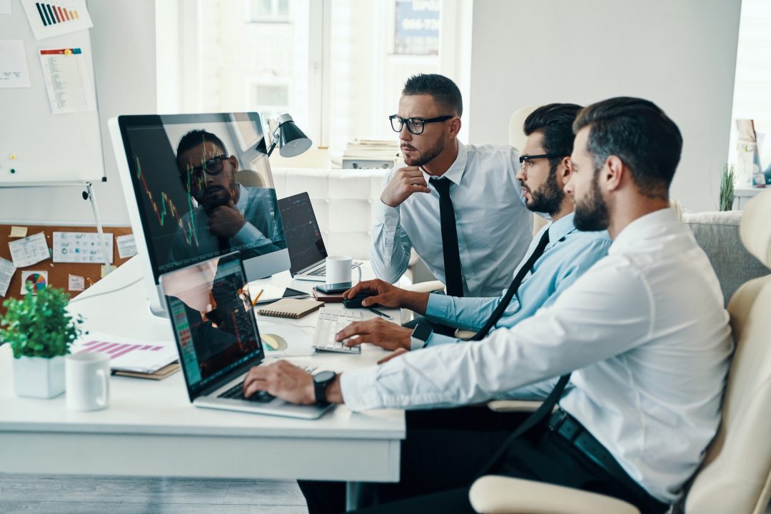 People at desk working together