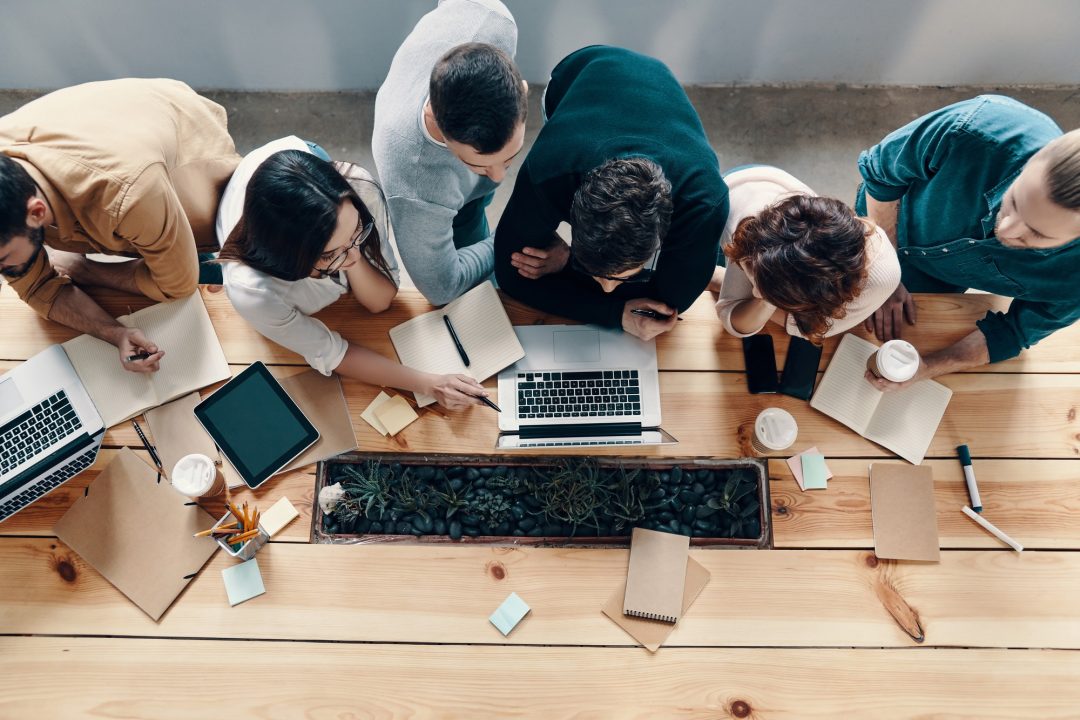 People at desk working together